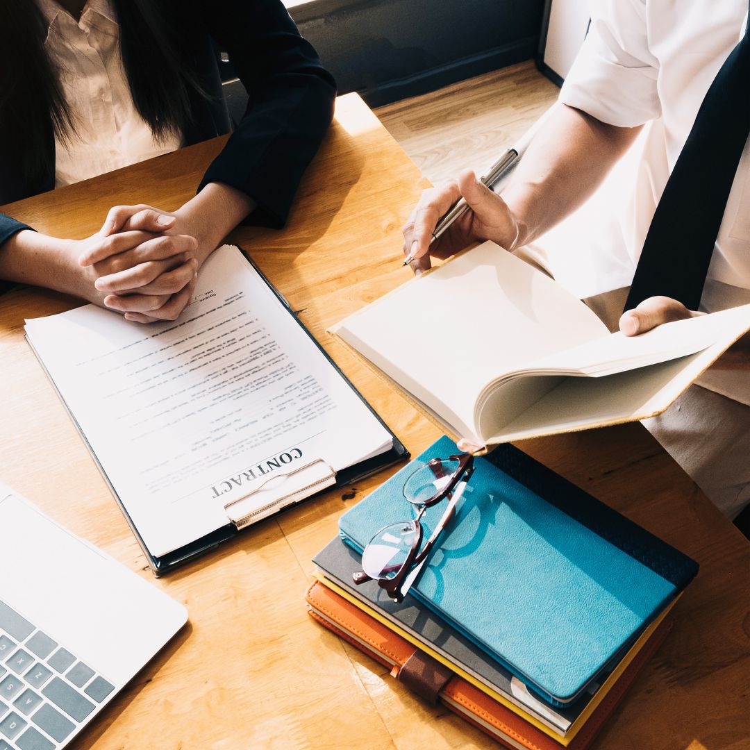 Lawyer and client reviewing paperwork