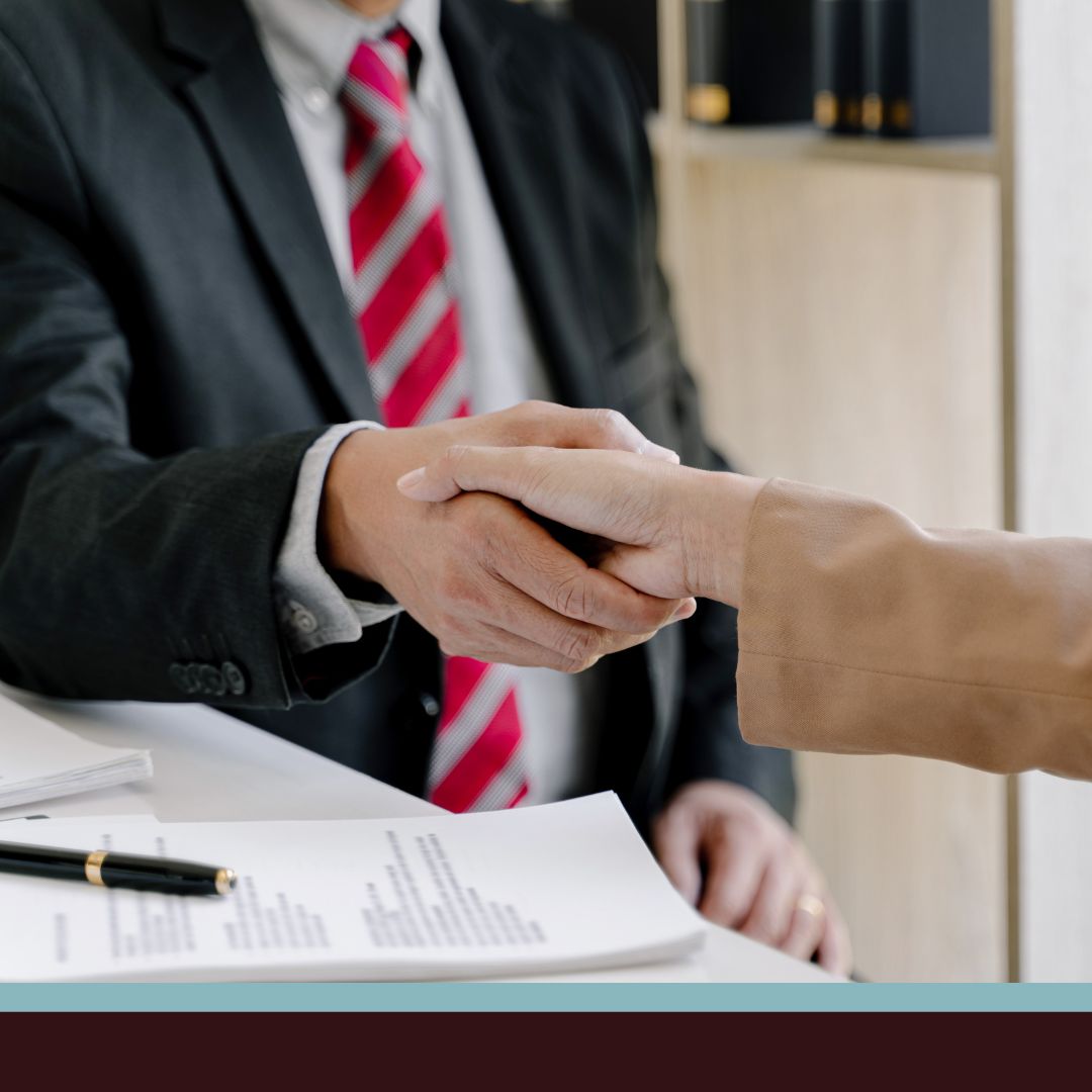 lawyer helping client shaking hands