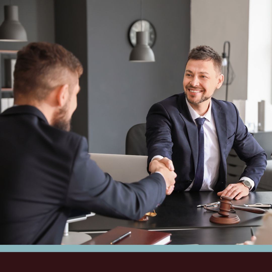 A lawyer and a client shaking hands