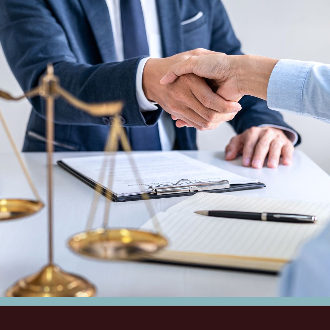A lawyer shaking hands with a client
