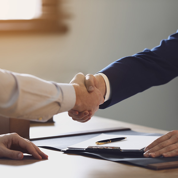 lawyer and client shaking hands