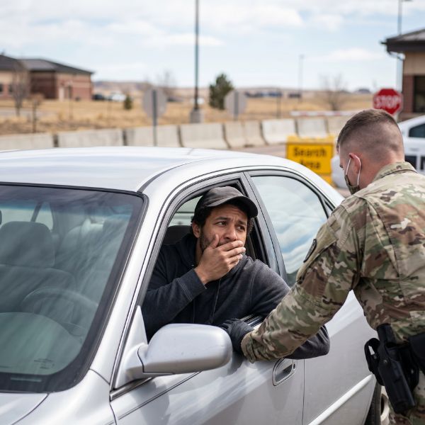 man at military gates